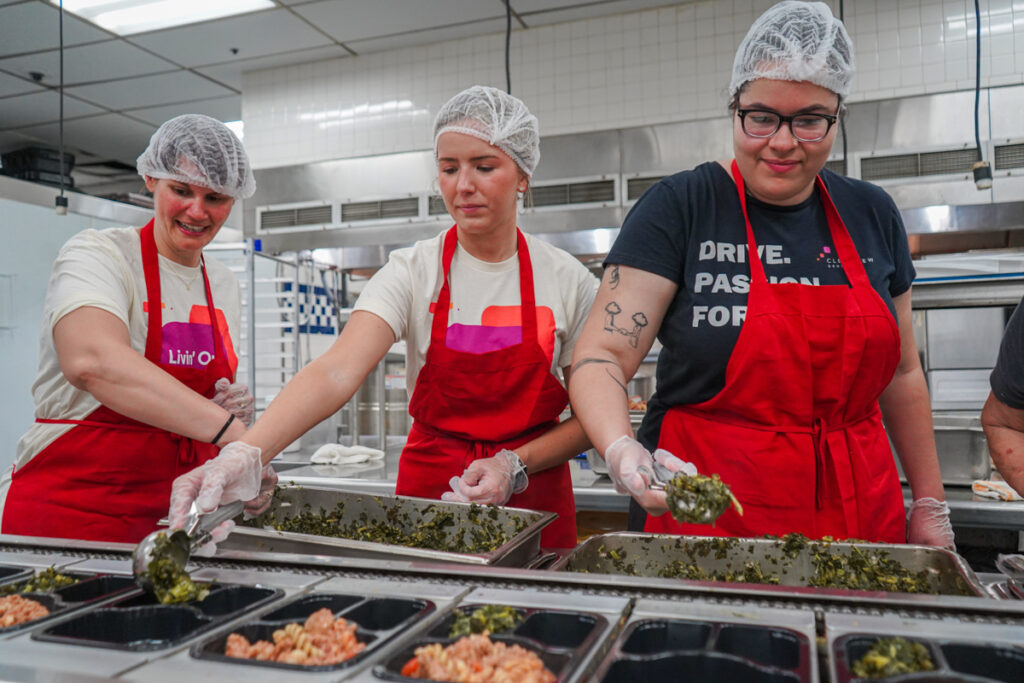 Clearview employees prepare individually packed meals at the Meals on Wheels kitchen and distribution center.